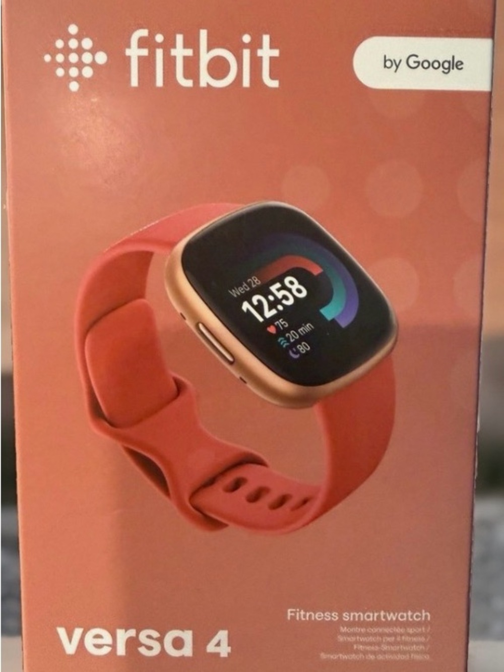 fitbit Versa 4 Coral with Gold-Tone Case